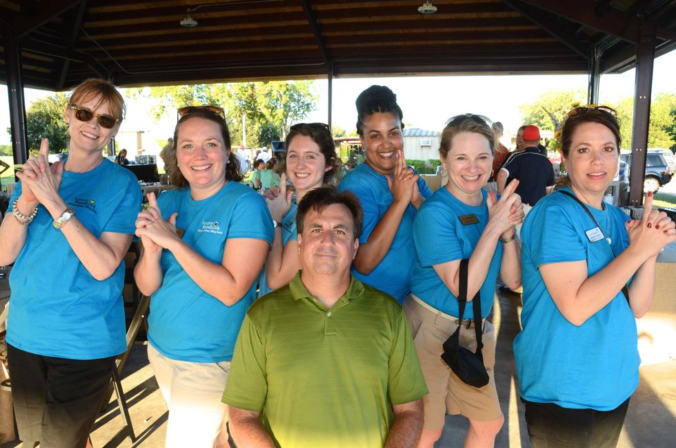 253 Paula McKenzie, from left, Carrie Grzelak, Emma Langley, Brian Greene, Brooke Curtis, Amy Ragan and Jennifer Reeves at the Backpack Buddies sport shooting event September 2014