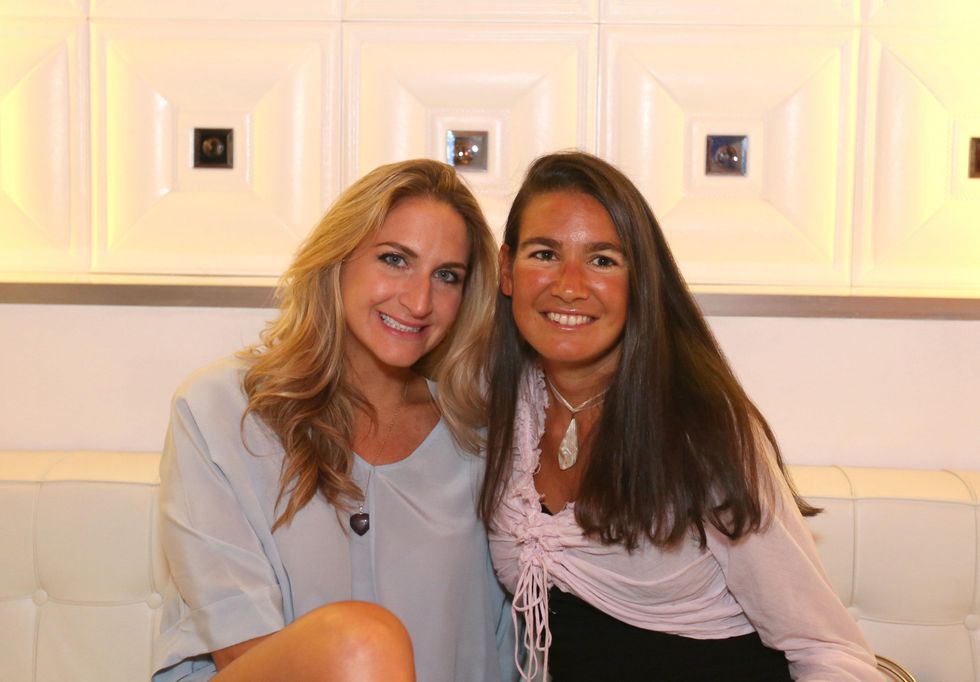 2735 Sarah Hartland, left, and Anne Burgot at the Crimson grand opening party July 2014