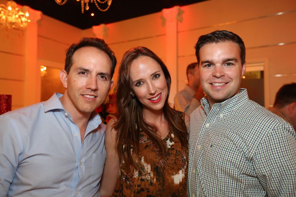 2746 Alejandro Armijos, from left, Ronel Golden and Owen Davies at the Crimson grand opening party July 2014