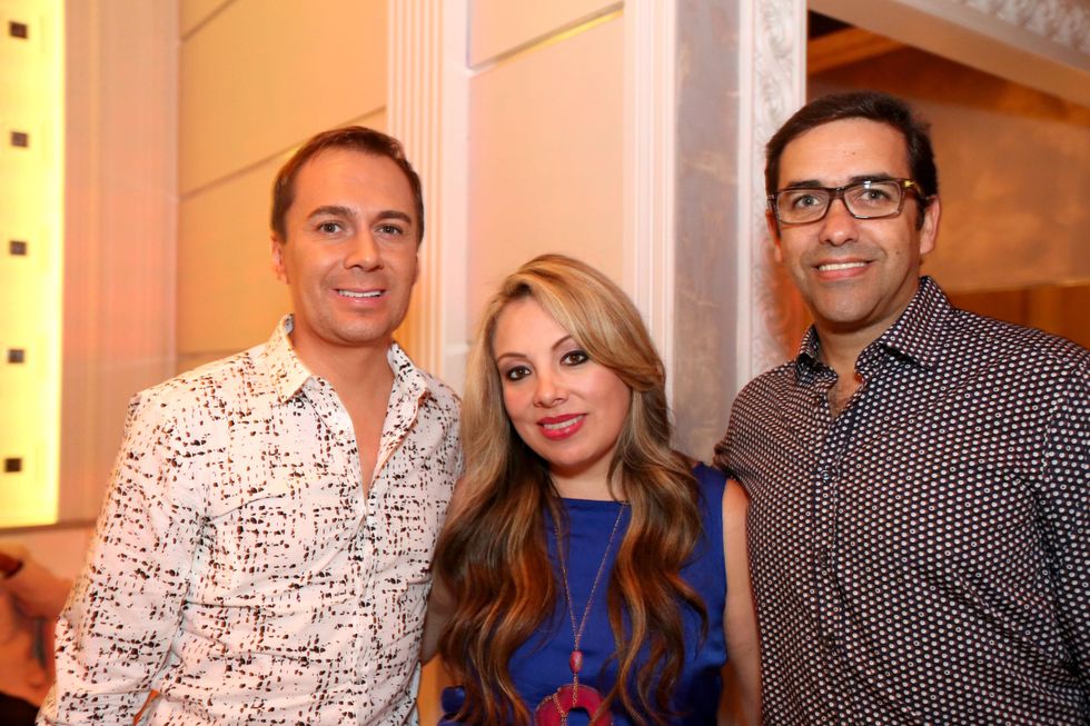 2797 Adrian Duenas, from left, Karen Hernandez-Lix and Marcelo Saenz at the Crimson grand opening party July 2014