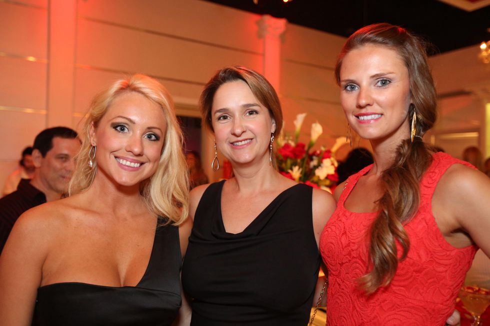 2811 Meghann Smith, from left, J.L. Carpenter and Brandee Karr at the Crimson grand opening party July 2014