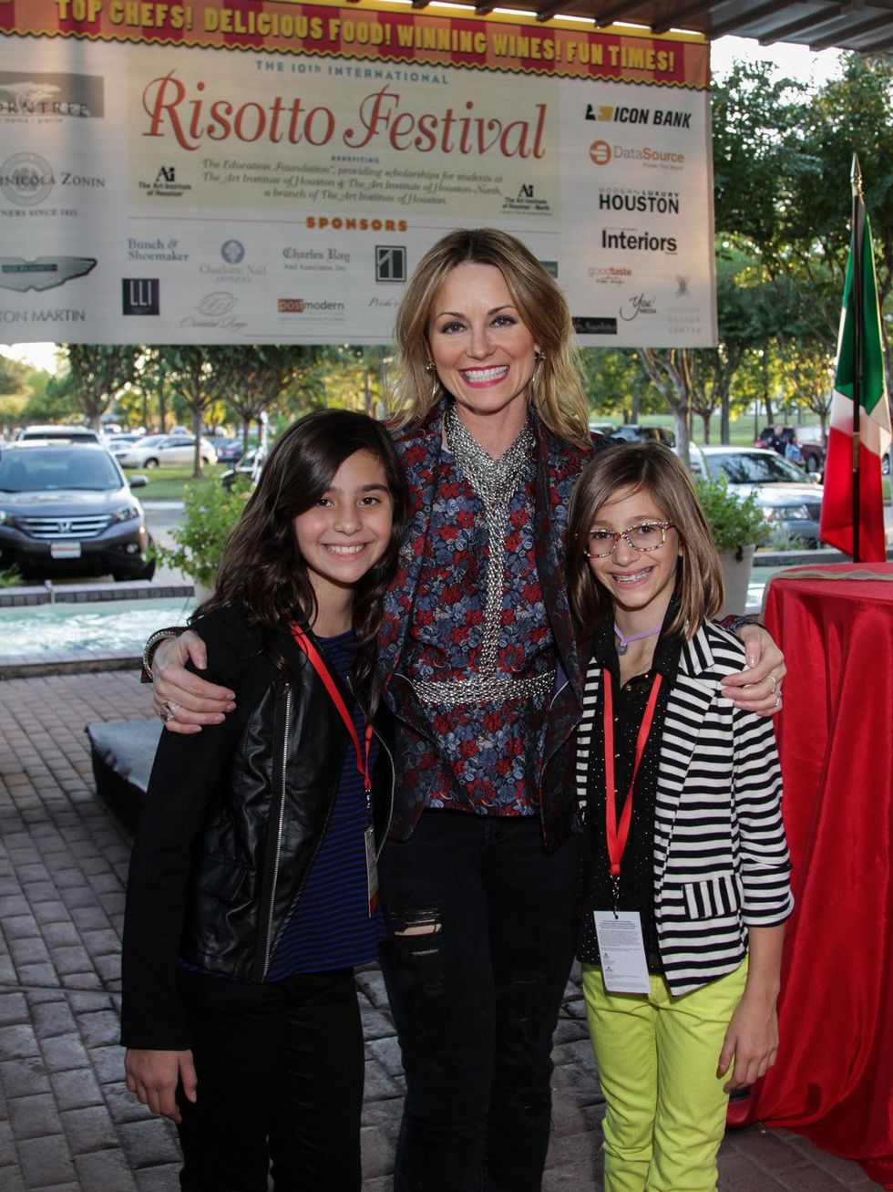 2959 Lucinda Loya, center, with daughters Ana Luca Loya, left, and Elena Loya at the Risotto Festival November 2013