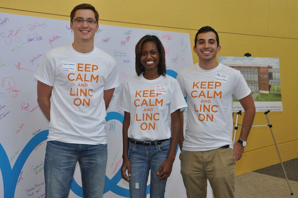 3 Scott Luettgen, from left, Stephanie Bension and Max Levy at young professionals build Tiny Libraries September 2014