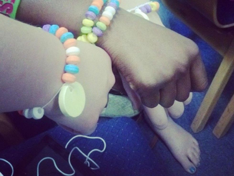 34-year-old Charity Johnson poses as 15-year-old student friendship love bracelets May 2014