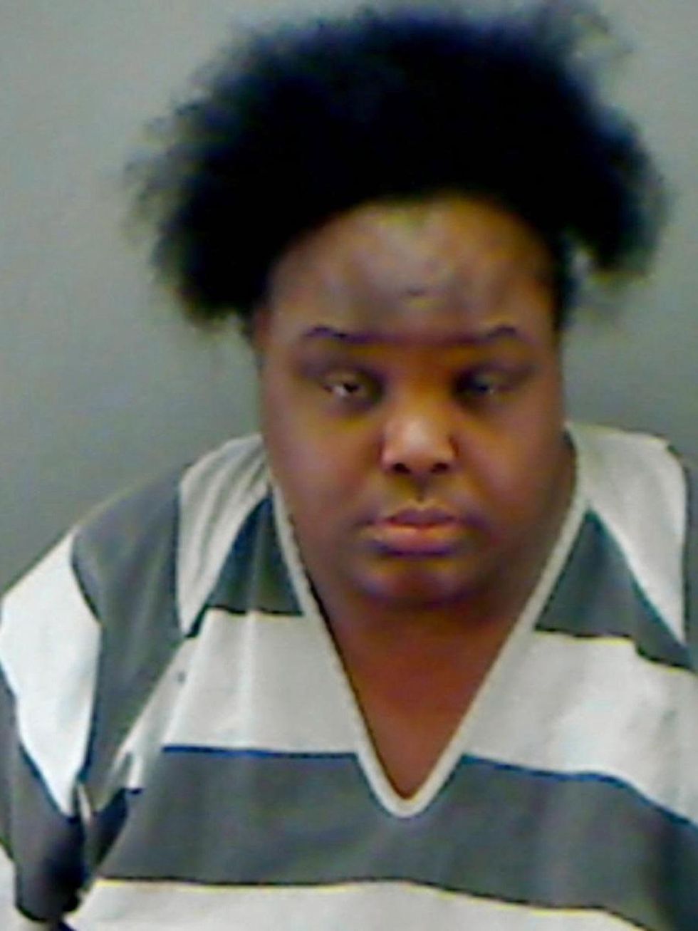 34-year-old Charity Johnson poses as 15-year-old student May 2014 mug shot