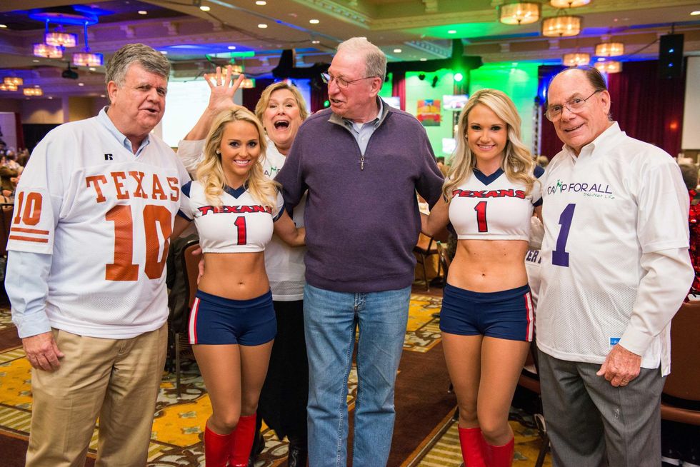 357 Larry Neuhaus, from left, left, Dr. Bob Zeller and Dr. Paul Gerson with Texans cheerleaders at the Camp For All Super Ball February 2015