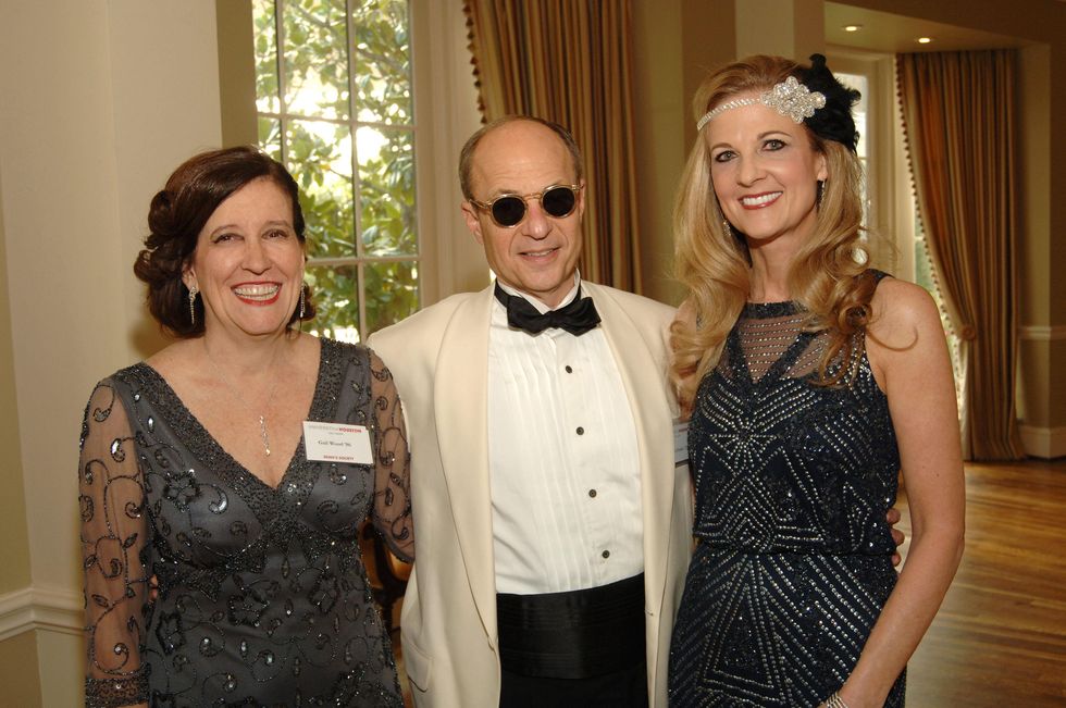 39 Gail Wood, from left, with Sam and Melinda Stubbs at the UH Law Center Gala April 2014
