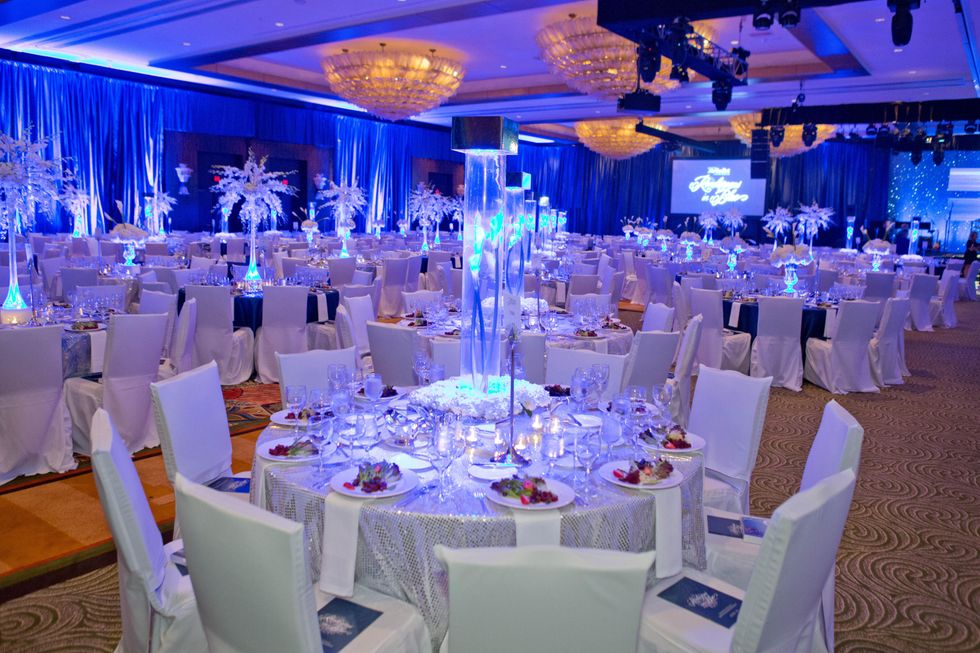392 113 venue with table settings place settings in the Hilton Americas ballroom at Houston Methodist's Rendezvous in Blue Gala November 2013