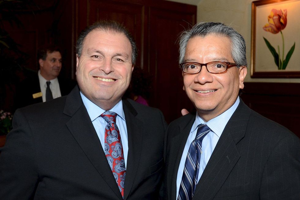 42 Larry Elizondo, left, and David Ruiz at the Houston Food Bank dinner April 2014