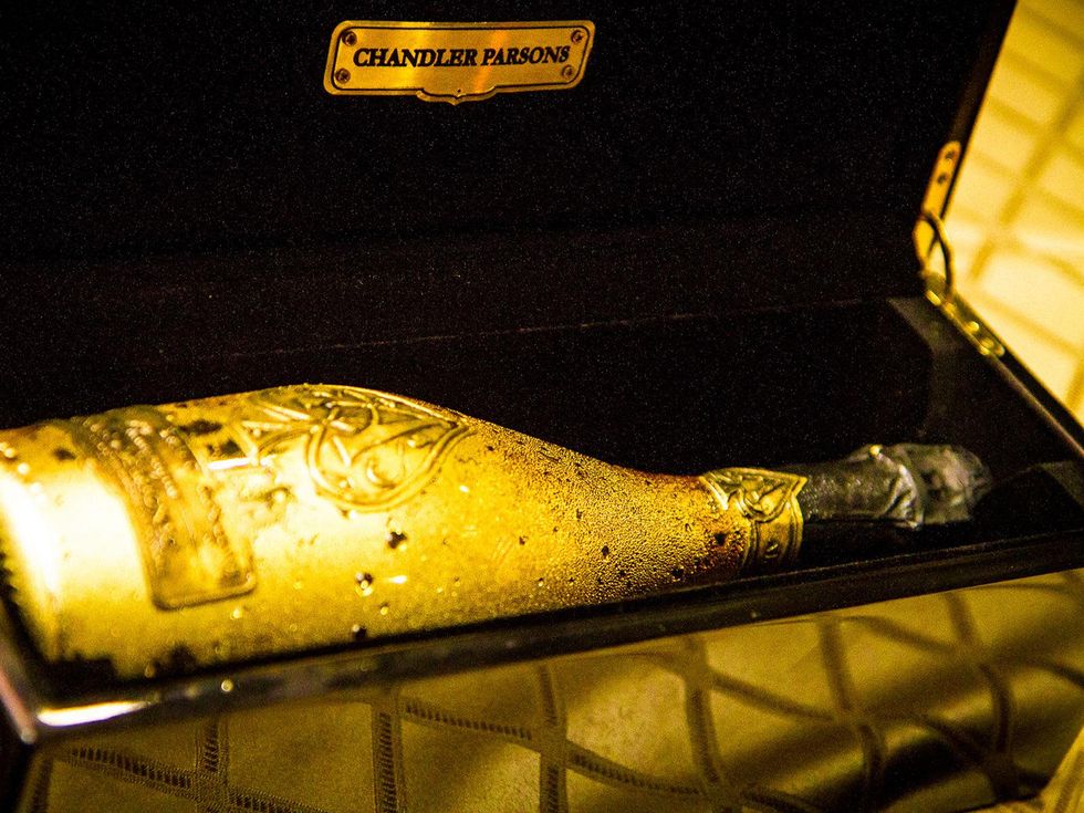 46 champagne bottle in personalized case at Chandler Parsons' birthday at Mr. Peeples October 2013