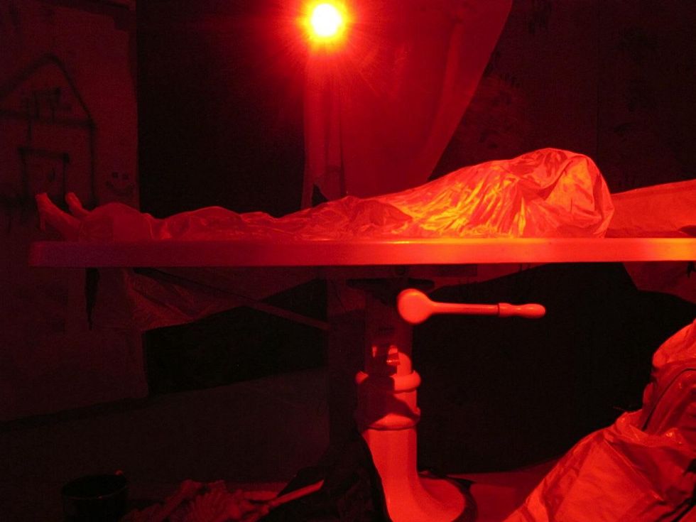 5 - Katie Oxford Halloween October 2014 3rd Annual Haunted House. Deceased on authentic embalming table rises from the waist up.