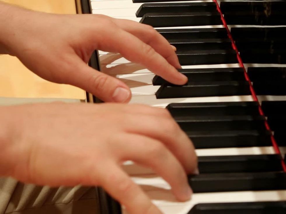 5 Kirill Gerstein prepares piano for Houston Symphony performance September 2013