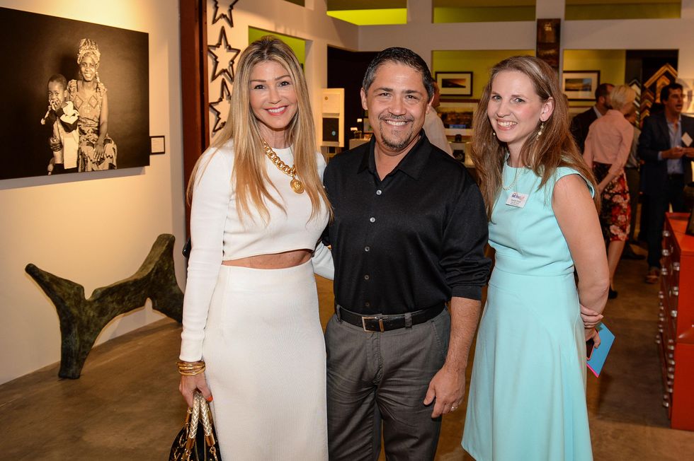 52 Patti Murphy, from left, Bruce Padilla and Rachael Wright at the HeartGift photo exhibition May 2014