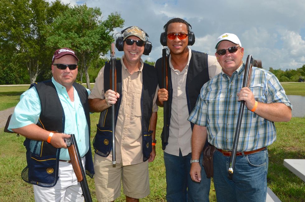58 Robert Reed, from left, Derryl Cleveland, Peter Goebel and Bo Luzey at the Backpack Buddies sport shooting event September 2014