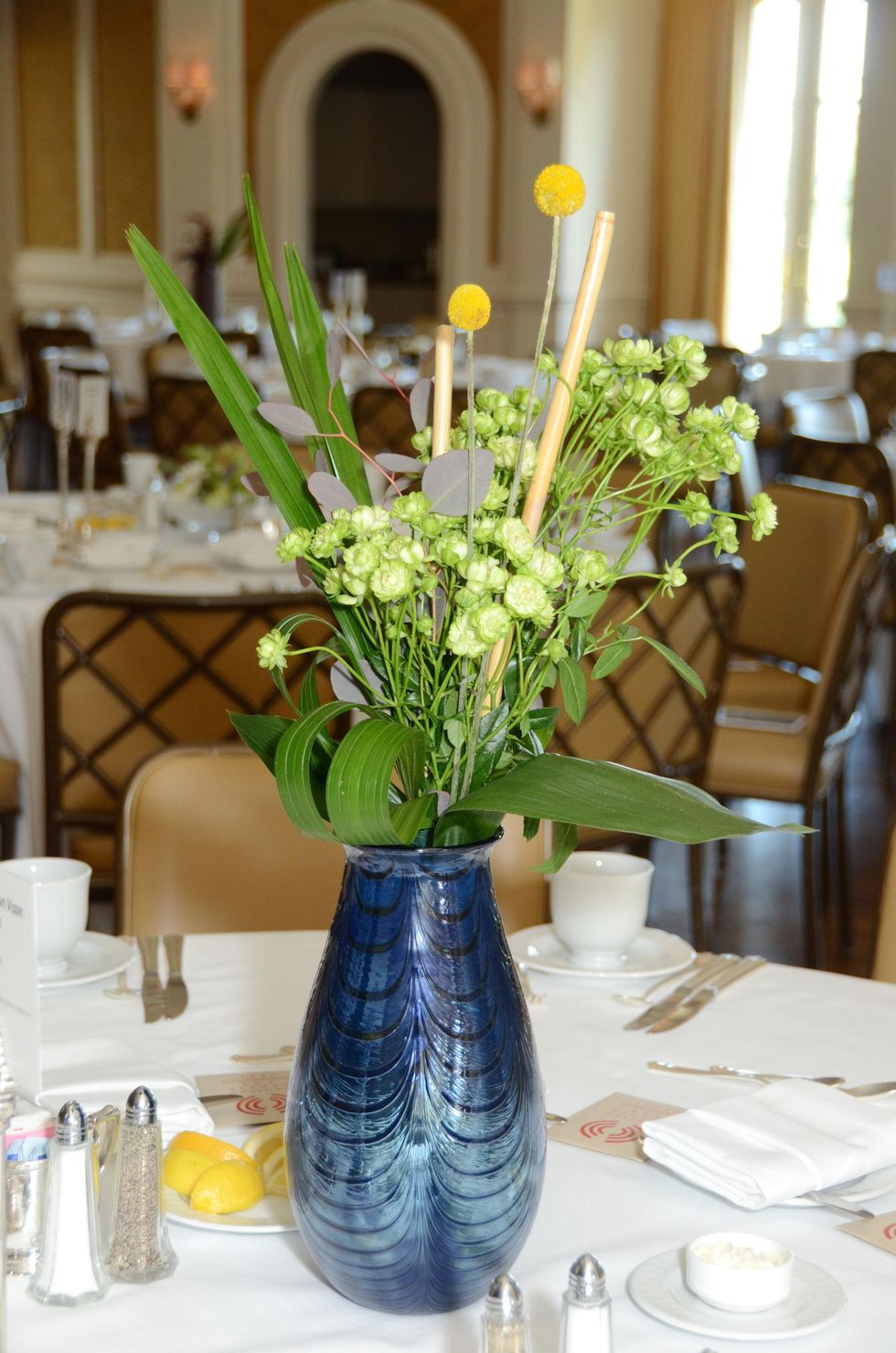 6 Table setting with centerpiece at the Houston Center for Contemporary Craft spring luncheon May 2014