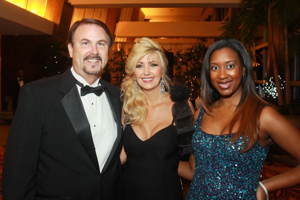 62 Michael and Belva O'Mara, from left, with Danielle White at the UNCF Gala November 2013