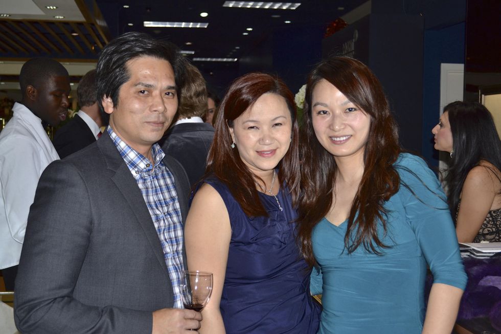 62 Wayne and Tammy Nguyen, from left, with Cynthia Xue at the Zadok Holiday Party December 2013