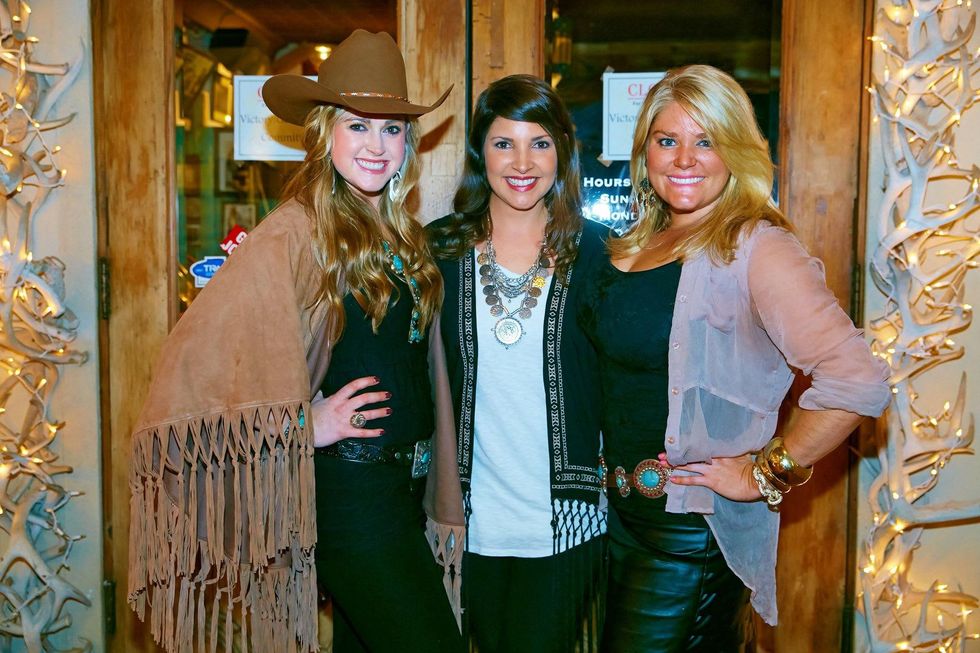 6655 Price DuBose, from left, Ashley Wright and Cody Tinney at the Cattle Baron Gentlemen's Committee party February 2015