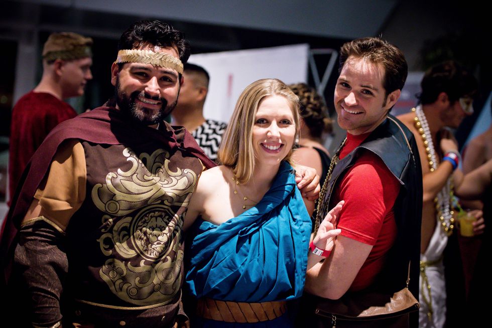 7 Daron Moreno, from left, with Jennifer and Steve McGrath at the Bering Omega Toga Party July 2014