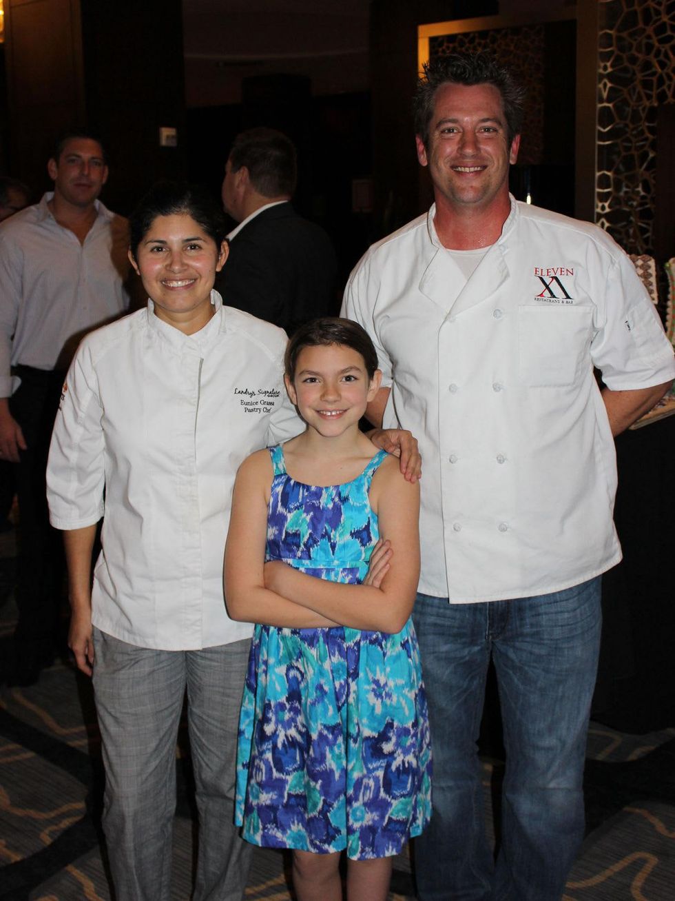 7 Eunice Grassa, from left, Grace DeLaune and Kevin Bryant at the Lucky Dog Gingerbread Doghouse event December 2013