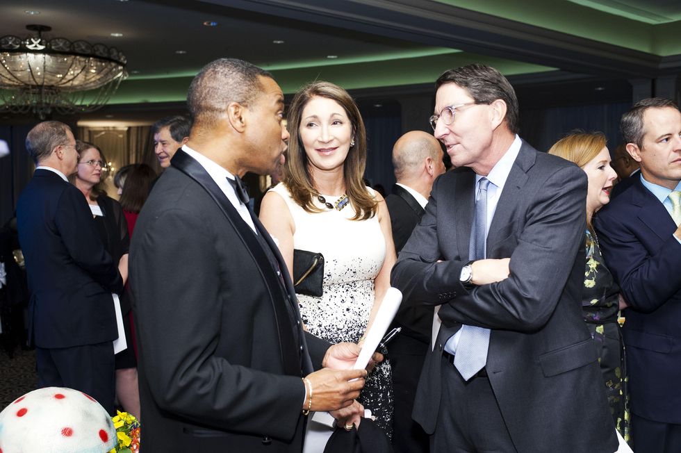 7493 Khambrel Marshall, from left, with Soraya and Scott McClelland at the Collaborative for Children dinner October 2014