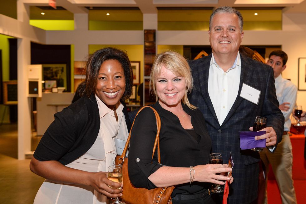 75 Deborah Fronza, from left, Shay Hiner and Art Arnold at the HeartGift photo exhibition May 2014