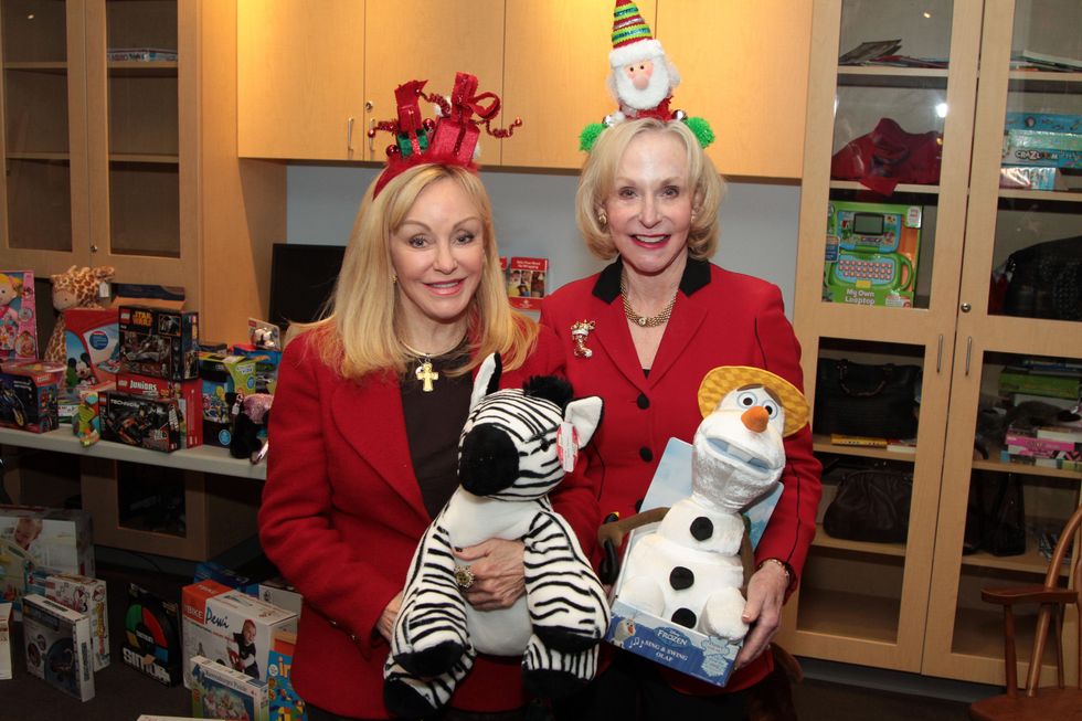 75 Judi McGee, left, and Carolyn Mann at Santa visits Texas Children's Cancer Center December 2014