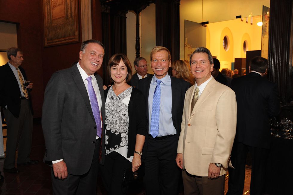 8 5681 Marc Melcher, from left, Leigh Smith, Jonathon Glus and Roland Garcia Jr. at the Port of Houston library exhibition celebration September 2014