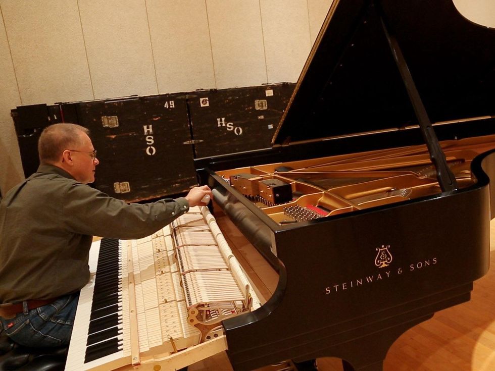 8 Kirill Gerstein prepares piano for Houston Symphony performance September 2013