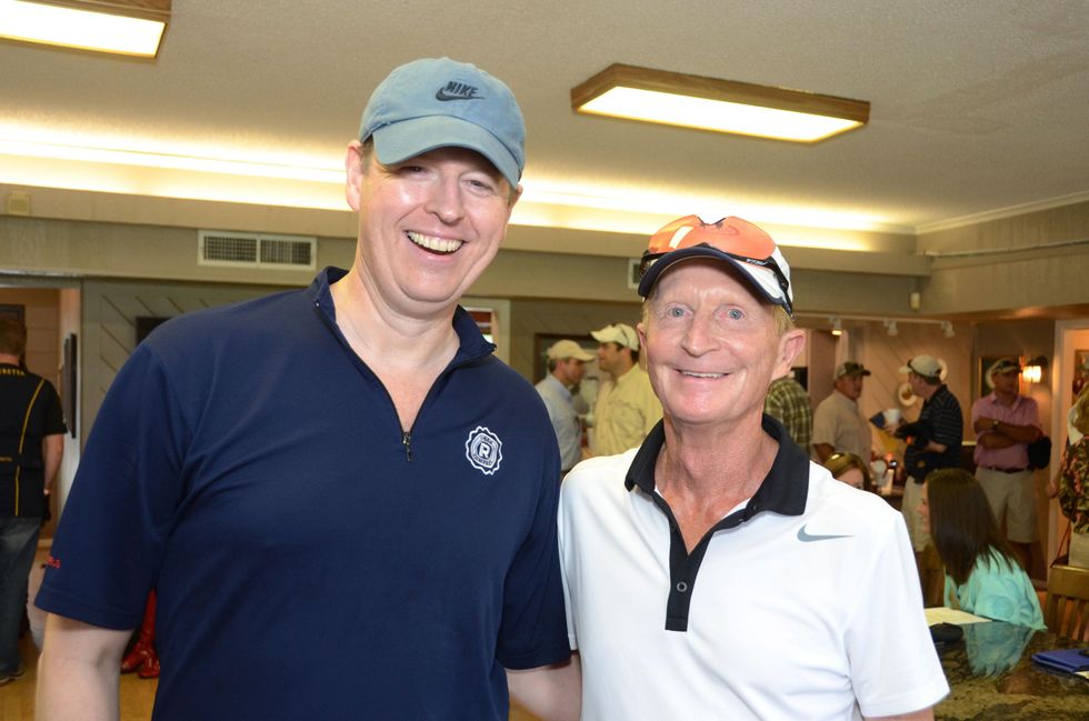 8 Tom Burke, left, and George Ball at the Backpack Buddies sport shooting event September 2014