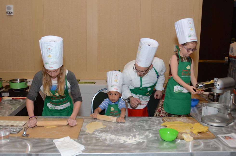 82 The Raviolo Team from left Ludovica Duchini, Emilio Fronza, Executive Chef Maurizio Ferrarese and Domenica Sepe at Tutti ai Fornelli de La Piccola Cucina March 2015