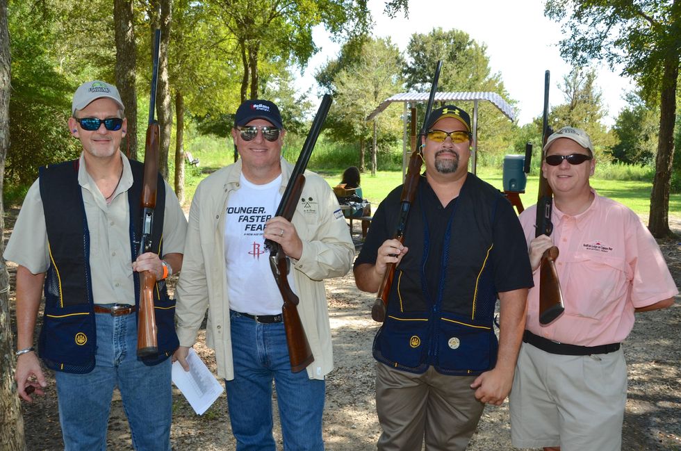 85 Kurtz Stowers, from left, Skip Zahn, Dave Perez and Frank Smejkal at the Backpack Buddies sport shooting event September 2014