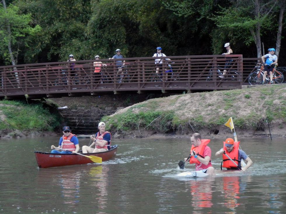 9 Alan Bunker, from left and Chris Hill in a canoe and Jason Slater and Trevor Best at Anything That Floats 2014