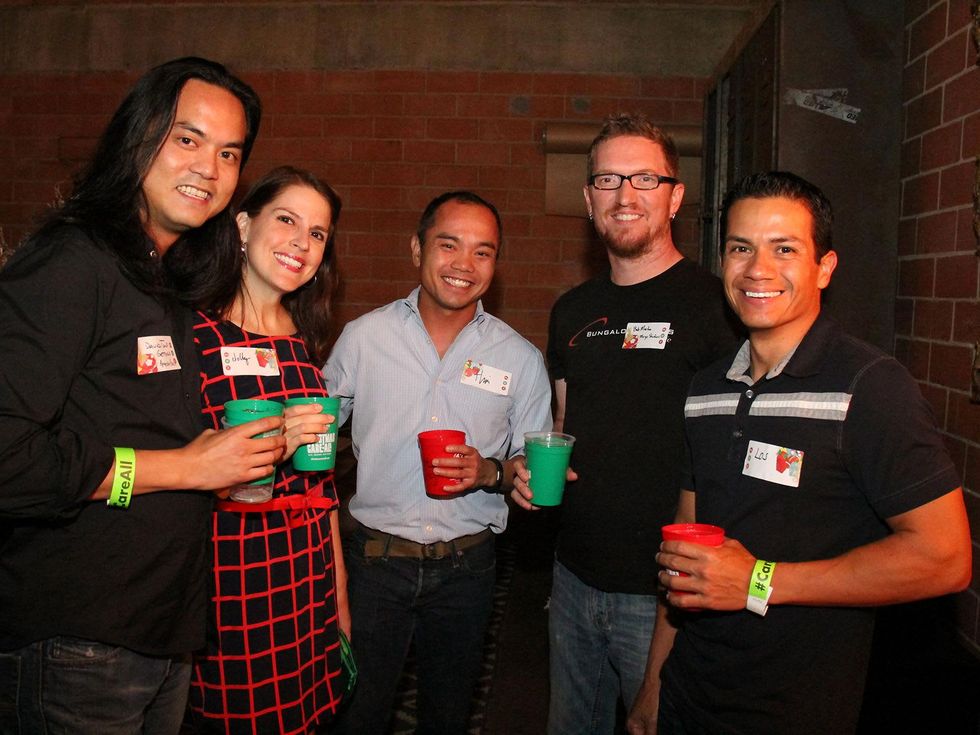 9 David Tong, from left, Michelle Sacks, Thai Tong, Bob Martin and Carlos Rubio at the Black Sheep Agency Care-All Christmas party December 2013