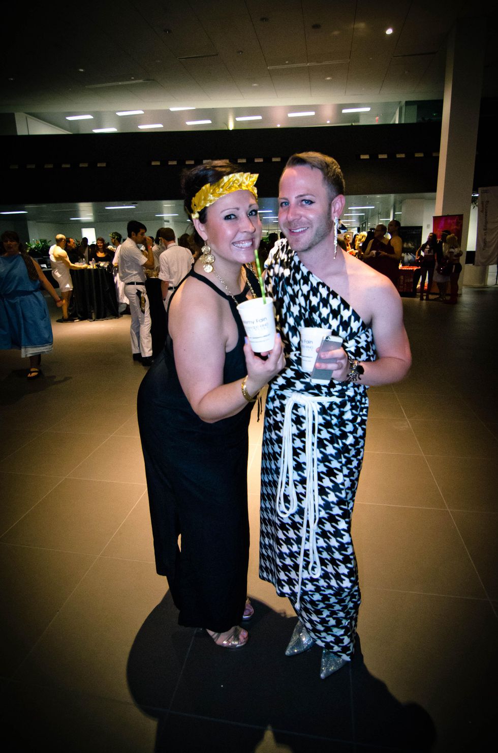 9 Event chairs Lindsey Moreno, left, and Jeremy Fain at the Bering Omega Toga Party July 2014