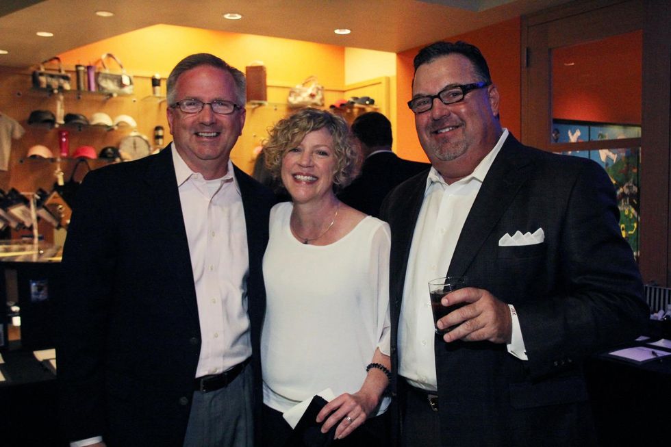 9 James and Deborah Harris, from left, with Jim Kole at the Mercedes-Benz of Sugar Land Cystic Fibrosis Event October 2014