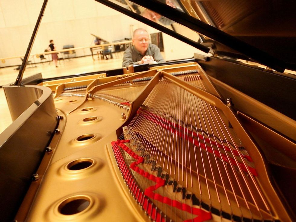 9 Kirill Gerstein prepares piano for Houston Symphony performance September 2013