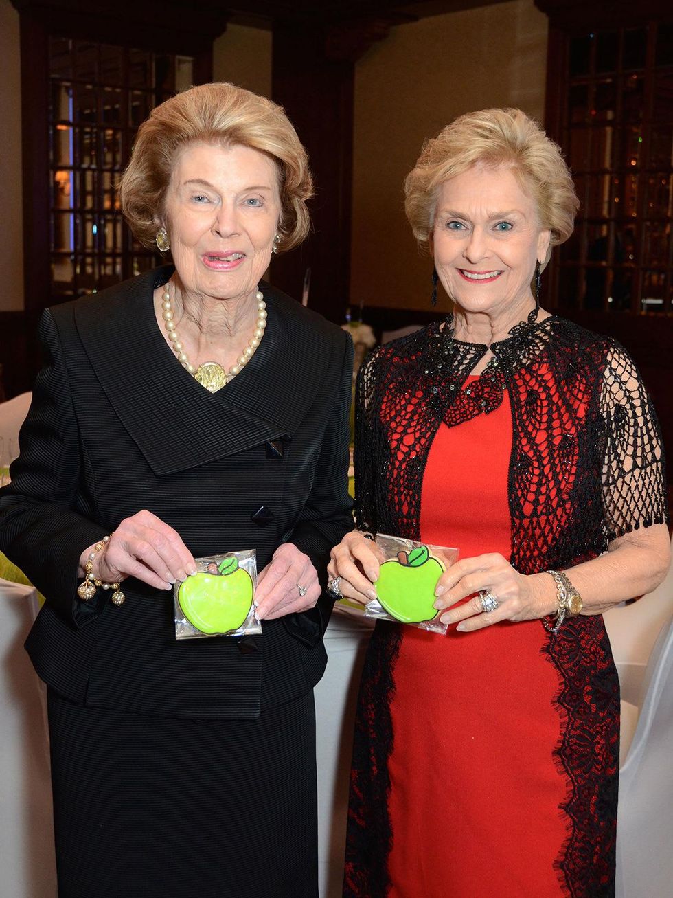 9 Patricia Reckling Taylor, left, and Annette Dewalch Strake at the Houston Food Bank dinner April 2014