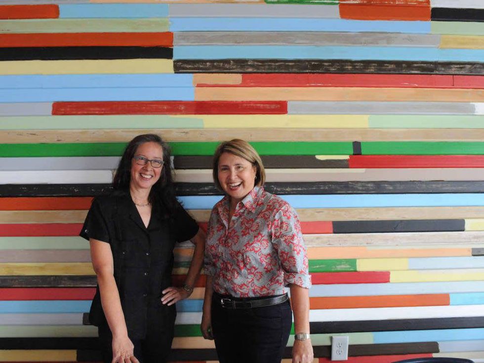 9 Red Ox Bar & Grill May 2014 owners against painted wall