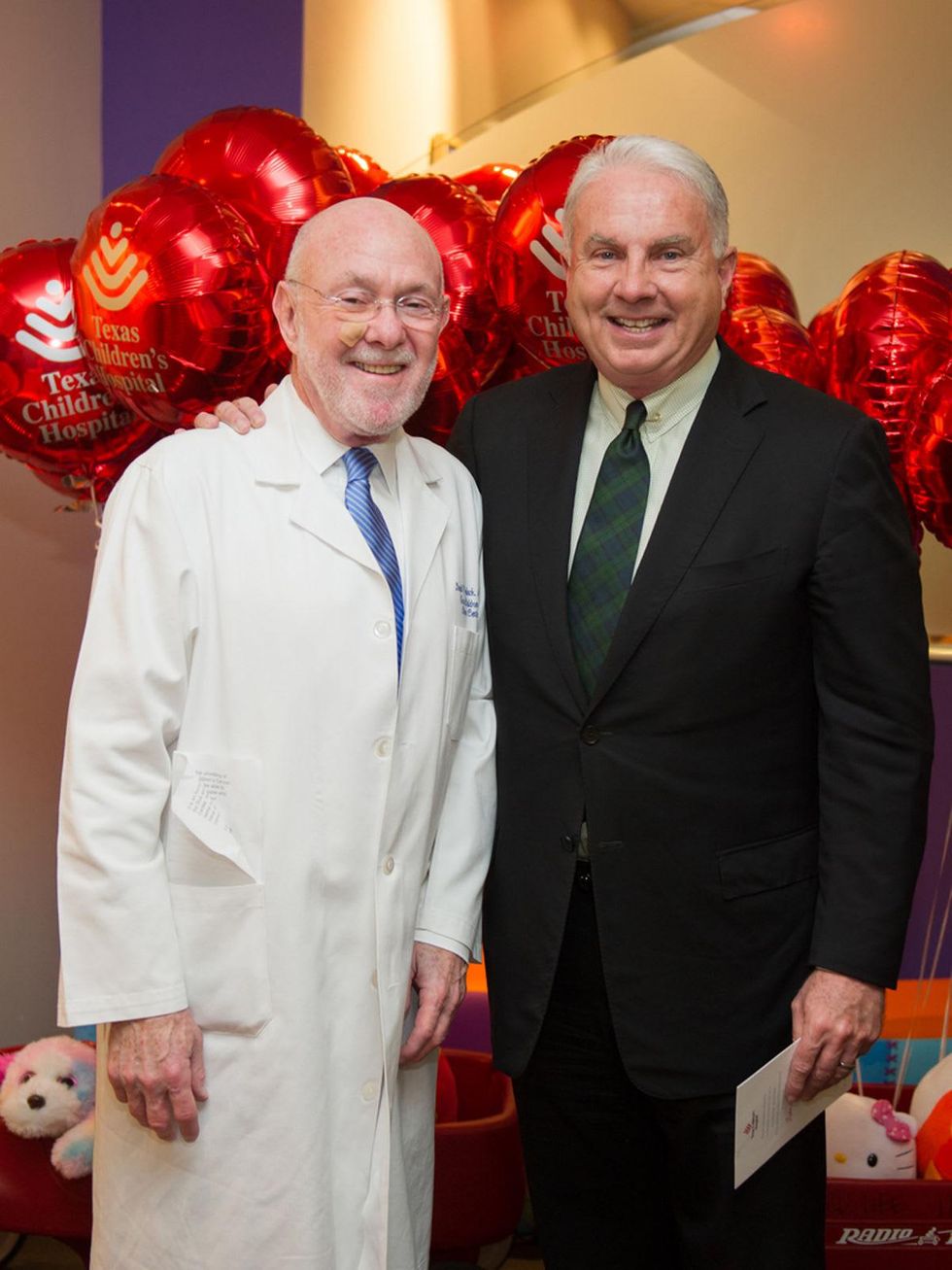 9595 Dr. David Poplack, left, and Mark A. Wallace at the Lester and Sue Smith Clinic dedication at Texas Children's Hospital May 2014