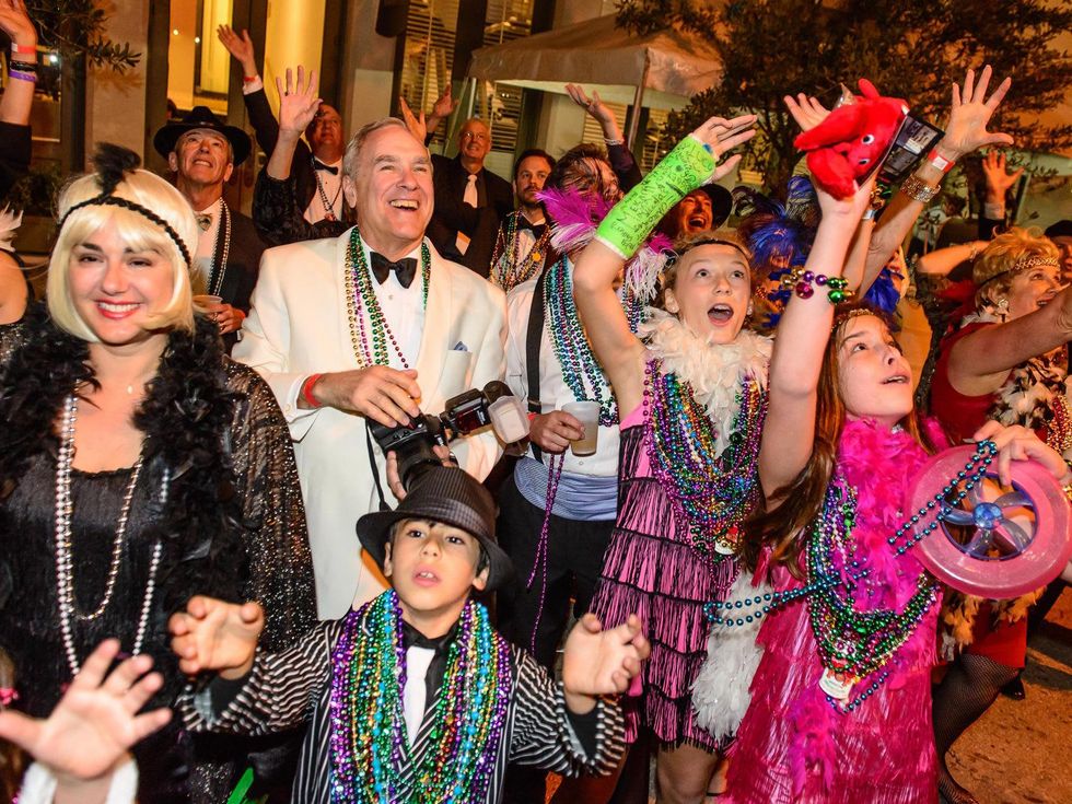9668 The crowd catching beads at the Tremont Ball March 2014