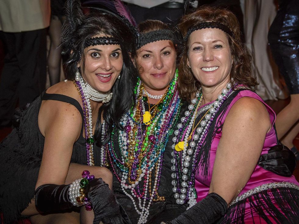 9913 Cindy Burkett, from left, Darcie Schlegel and Valerie Nabizadch at the Tremont Ball March 2014