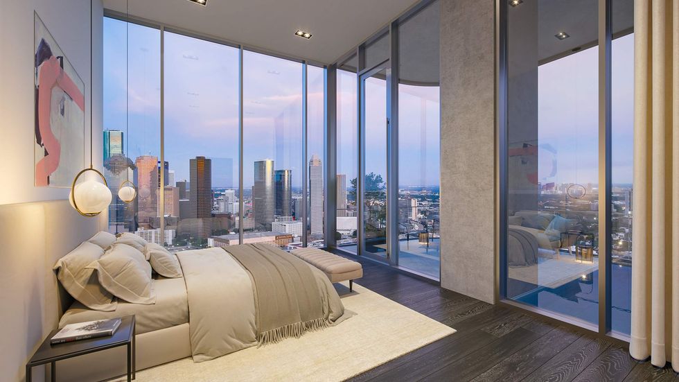A bedroom with panoramic views of Houston