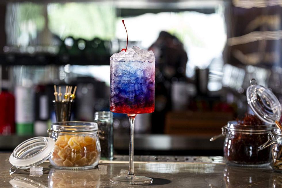 A Dance of Fire and Ice red, white, and blue cocktail at Duck N Bao