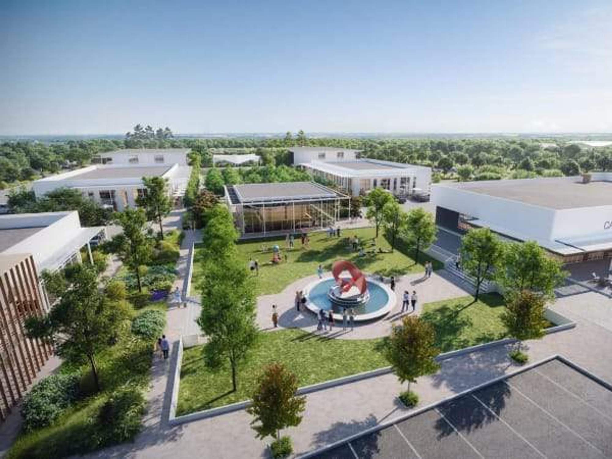 A quad full of people on a nice day in a housing development.