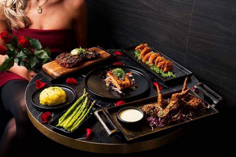 A round tray of Asian dishes