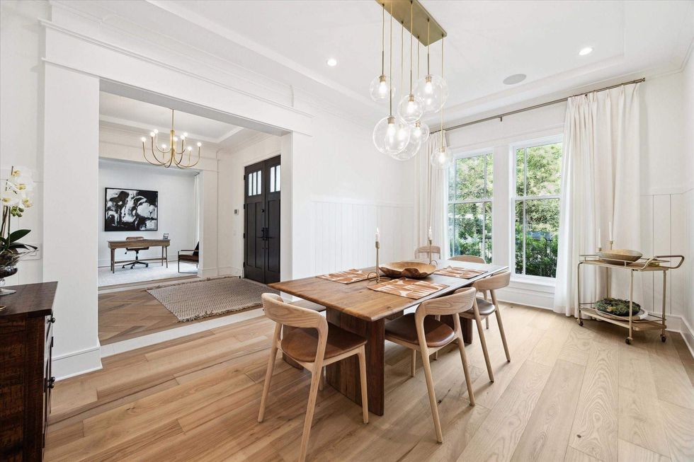 A view of the front door of 1039 Harvard Street, with a study on the right and dining room on the left as you enter.