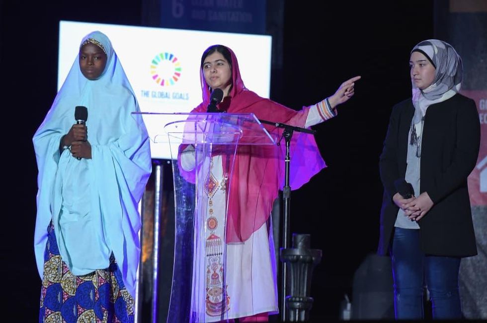 Activist Malala Yousafzai speaks on stage at the 2015 Global Citizen Festival