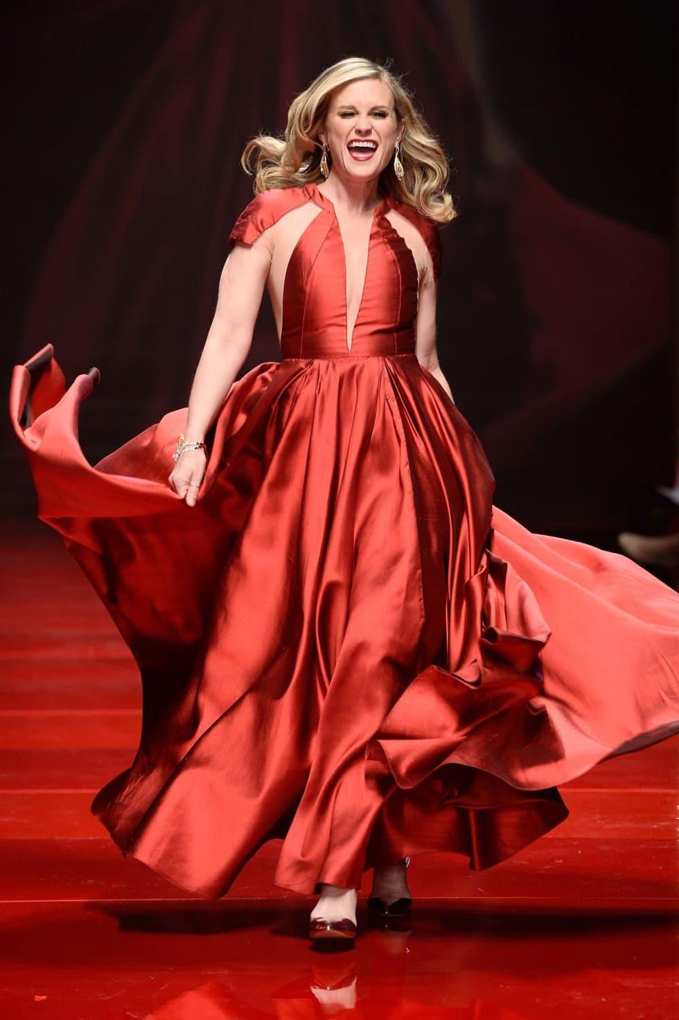 Actress Bonnie Somerville walks the runway at the American Heart Association's Go Red For Women Red Dress Collection