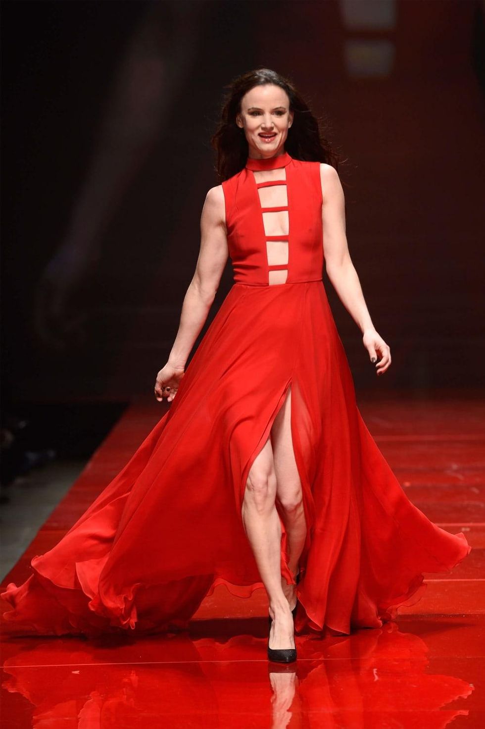 Actress Juliette Lewis walks the runway at the American Heart Association's Go Red For Women Red Dress Collection 2017